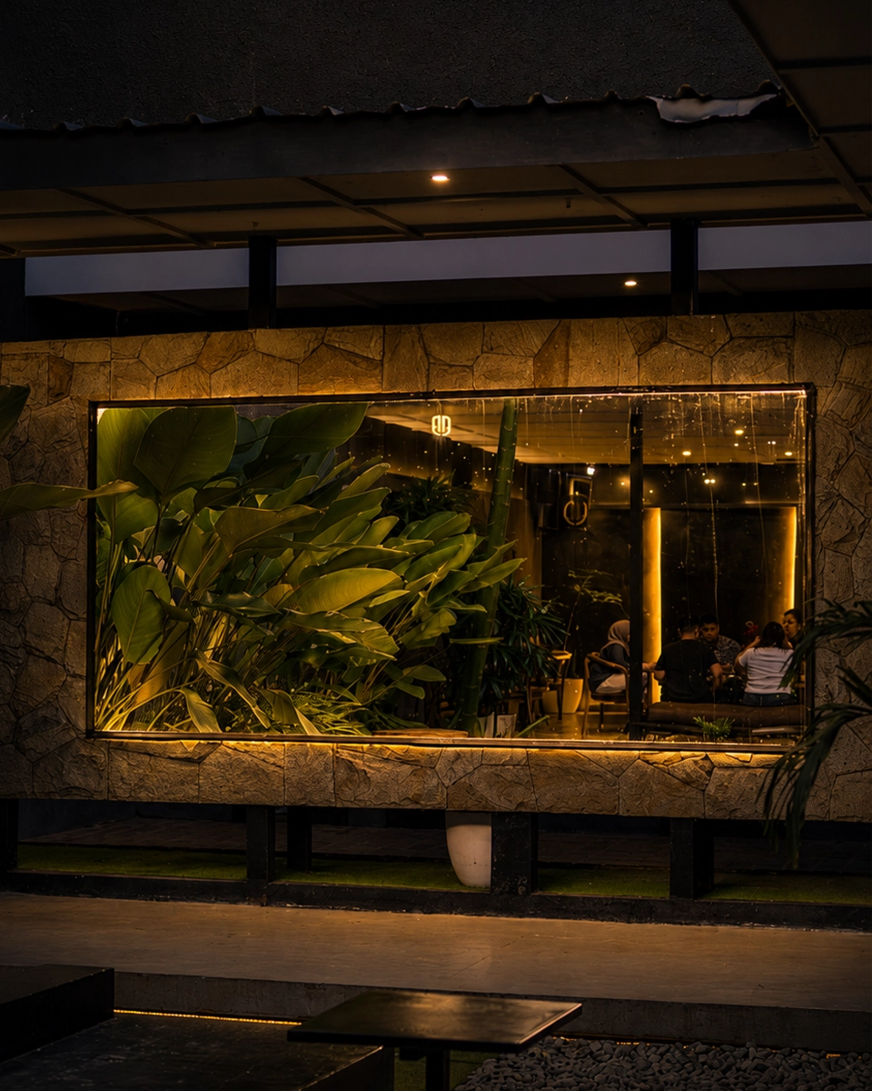 Velvet seating and palms inside the DJAWARA placeholder lounge